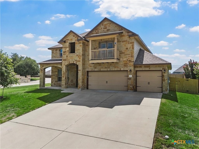 2014 Deer Field Way, Harker Heights, TX 76548 - view of front of house with stone siding, a balcony, concrete driveway, and a garage
