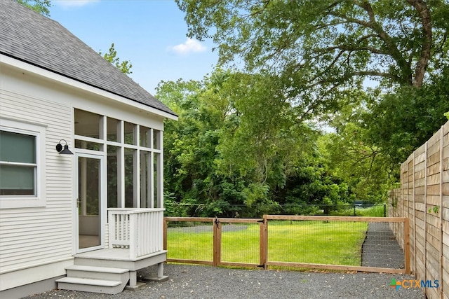 view of yard with a sunroom