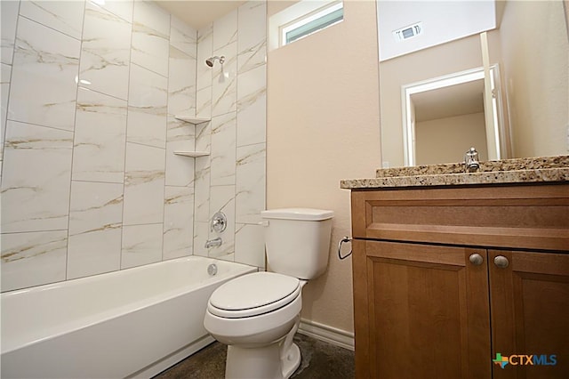 full bathroom featuring vanity, toilet, and tiled shower / bath combo