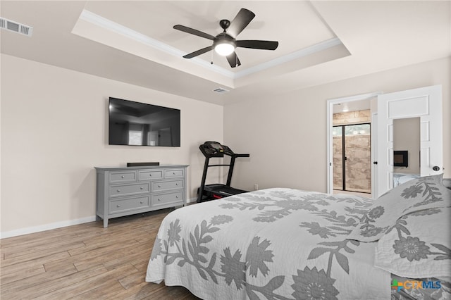 2727 Torino Reale Ave, Temple, TX 76502 - bedroom with ornamental molding, a raised ceiling, visible vents, and wood finished floors
