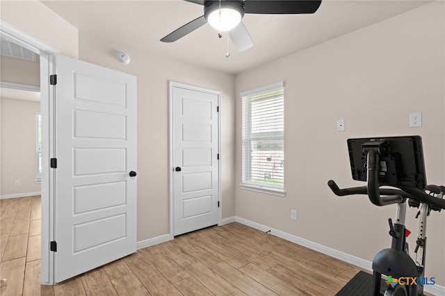 2727 Torino Reale Ave, Temple, TX 76502 - workout room with ceiling fan, baseboards, and light wood-style floors