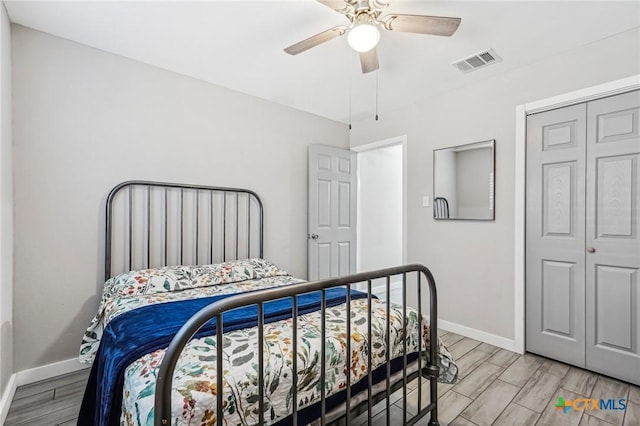 bedroom featuring ceiling fan and a closet