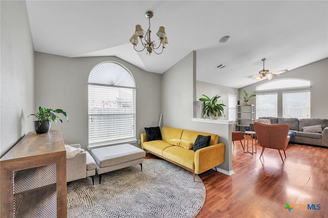 7123 Kevin Dr, Temple, TX 76502 - living area featuring lofted ceiling, healthy amount of natural light, wood finished floors, a chandelier, and ceiling fan