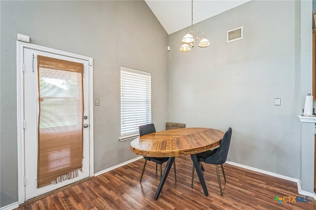 7123 Kevin Dr, Temple, TX 76502 - dining space featuring vaulted ceiling, dark wood finished floors, a chandelier, and baseboards