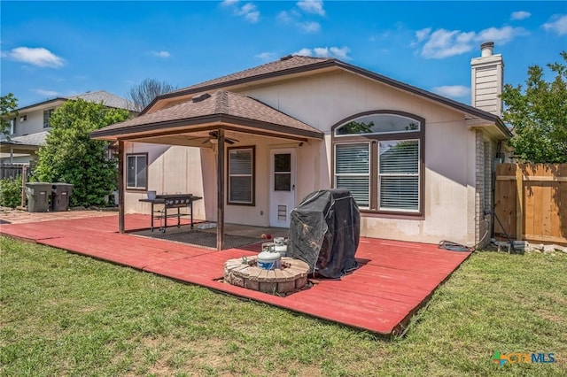 7123 Kevin Dr, Temple, TX 76502 - rear view of house featuring ceiling fan, a wooden deck, and a chimney