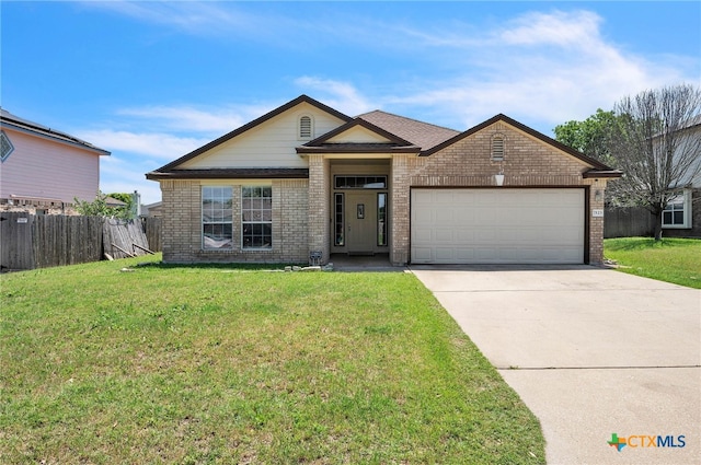 7123 Kevin Dr, Temple, TX 76502 - view of front of property with brick siding, an attached garage, and concrete driveway