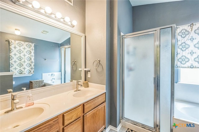 7123 Kevin Dr, Temple, TX 76502 - full bath featuring a shower stall, a bath, and double vanity
