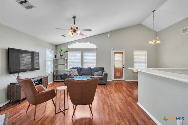 7123 Kevin Dr, Temple, TX 76502 - living area featuring vaulted ceiling, wood finished floors, baseboards, and a ceiling fan