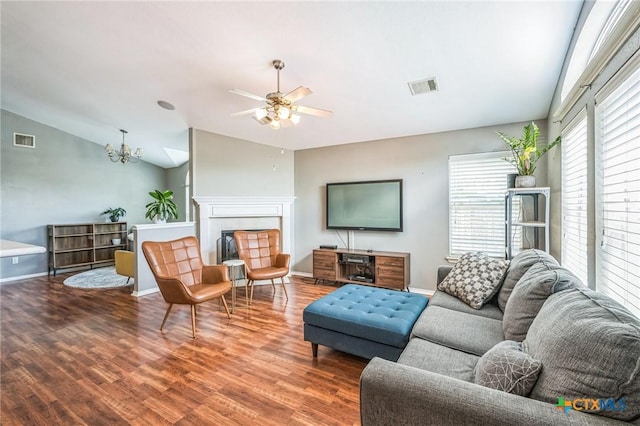 7123 Kevin Dr, Temple, TX 76502 - living room featuring wood finished floors, a ceiling fan, vaulted ceiling, a tile fireplace, and baseboards