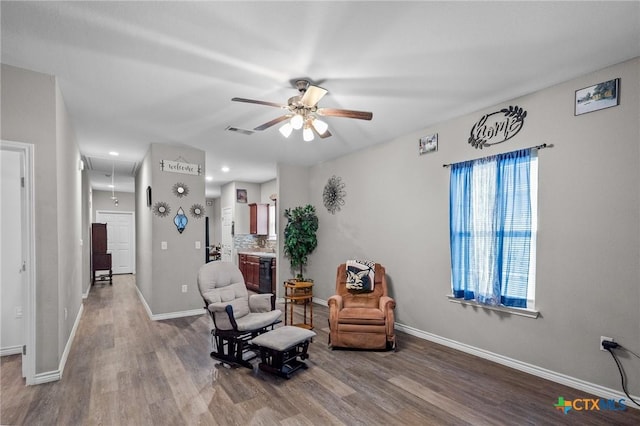 2709 Odem St, Victoria, TX 77901 - sitting room with attic access, a ceiling fan, wood finished floors, beverage cooler, and recessed lighting