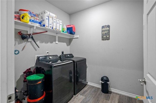 2709 Odem St, Victoria, TX 77901 - laundry area with independent washer and dryer and wood finished floors