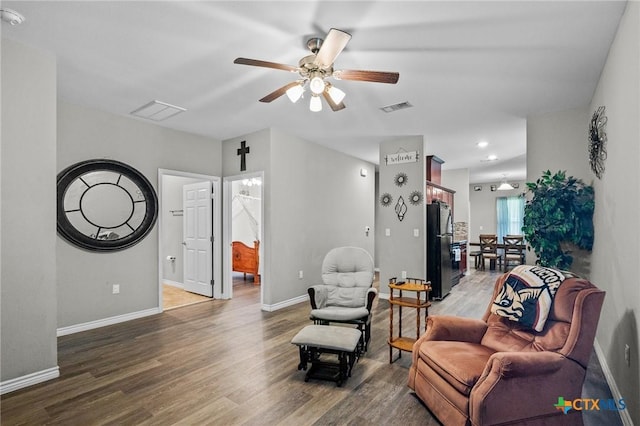 2709 Odem St, Victoria, TX 77901 - living room with wood finished floors, ceiling fan, and recessed lighting