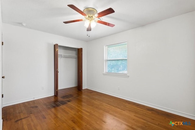 1708 Harley Dr, Harker Heights, TX 76548 - unfurnished bedroom with wood finished floors, baseboards, a closet, and a ceiling fan