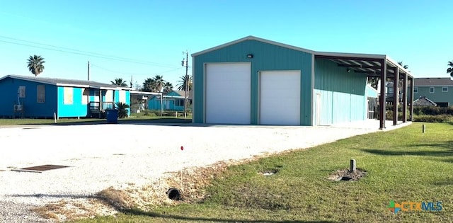 garage featuring a lawn