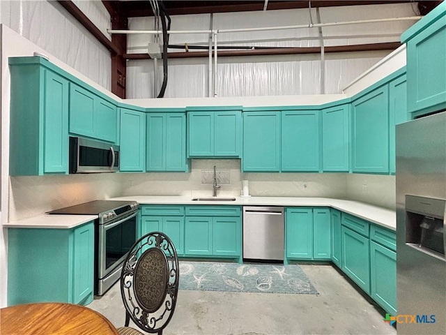 kitchen with sink and appliances with stainless steel finishes