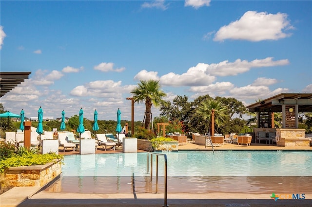 view of swimming pool featuring a patio