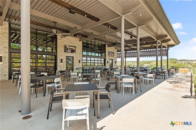 view of patio featuring ceiling fan