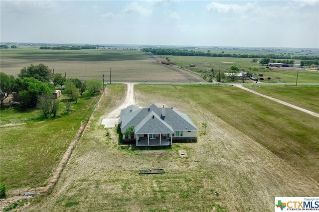 birds eye view of property featuring a rural view