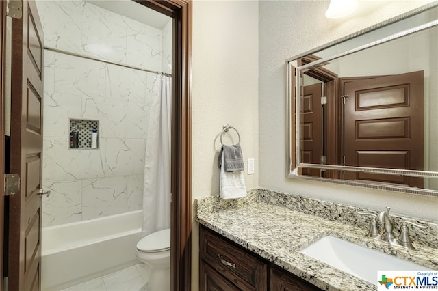 full bathroom featuring toilet, vanity, and shower / bath combo with shower curtain