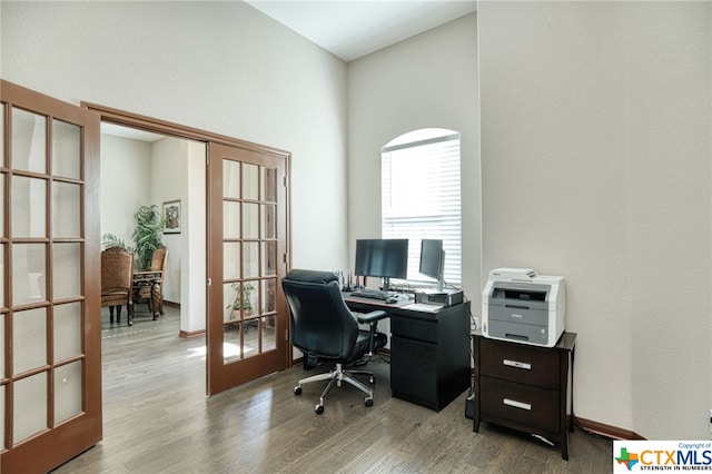 office area featuring french doors and light hardwood / wood-style floors