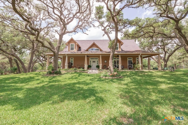 view of front of home featuring covered porch and a front yard