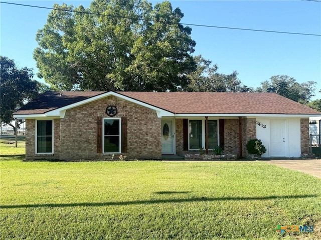 single story home with covered porch and a front yard