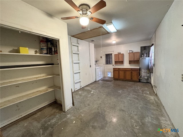 interior space with water heater and washer and clothes dryer