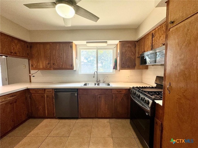 kitchen featuring black appliances, sink, ceiling fan, light tile patterned floors, and decorative backsplash