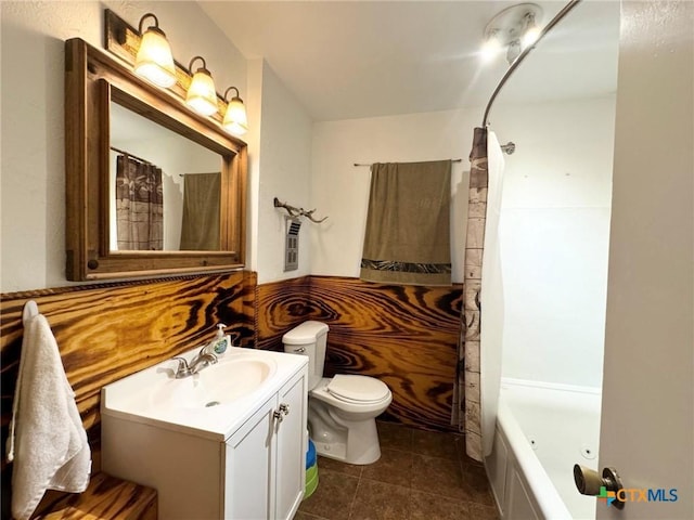 full bathroom featuring toilet, shower / bath combo, tile patterned floors, and vanity