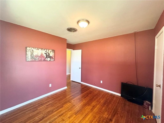 unfurnished bedroom with wood-type flooring