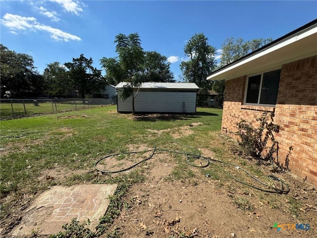 view of yard with a storage unit