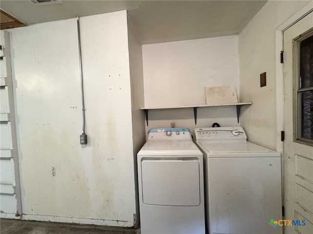 clothes washing area featuring washing machine and clothes dryer