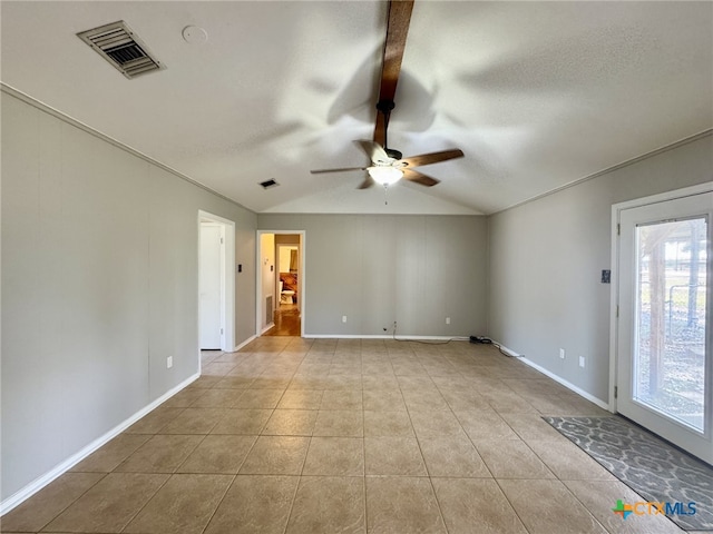 unfurnished room featuring ceiling fan, light tile patterned flooring, and lofted ceiling with beams