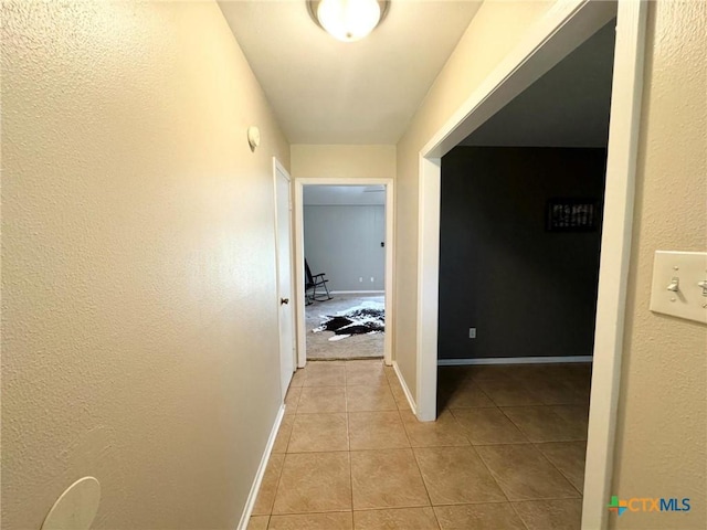 hallway with light tile patterned floors