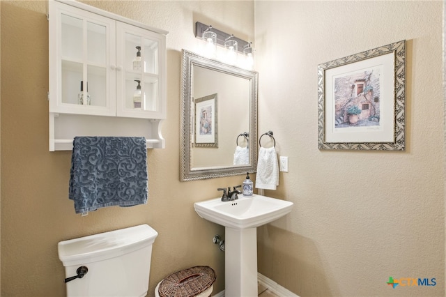 bathroom with sink and toilet