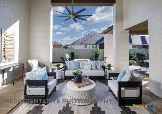 view of patio with outdoor lounge area and ceiling fan