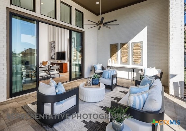 view of patio featuring an outdoor living space and ceiling fan