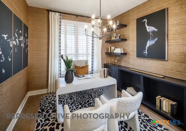 dining area with a notable chandelier and hardwood / wood-style flooring