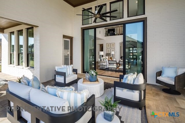 view of patio featuring ceiling fan and outdoor lounge area