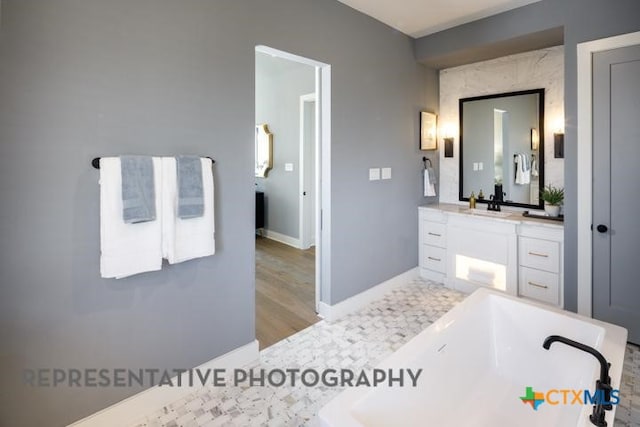 bathroom with vanity and hardwood / wood-style floors