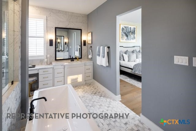 bathroom with vanity and hardwood / wood-style floors