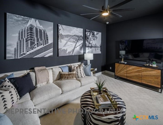 carpeted living room with ceiling fan