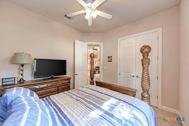 bedroom with ceiling fan, visible vents, baseboards, a closet, and carpet