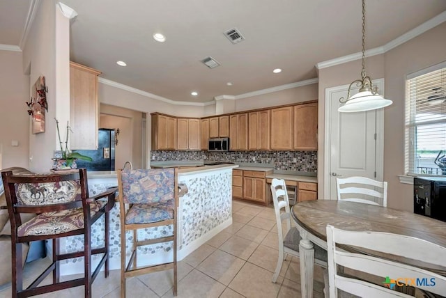 kitchen featuring stainless steel microwave, visible vents, decorative backsplash, and light tile patterned floors