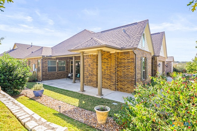 back of house featuring a patio area