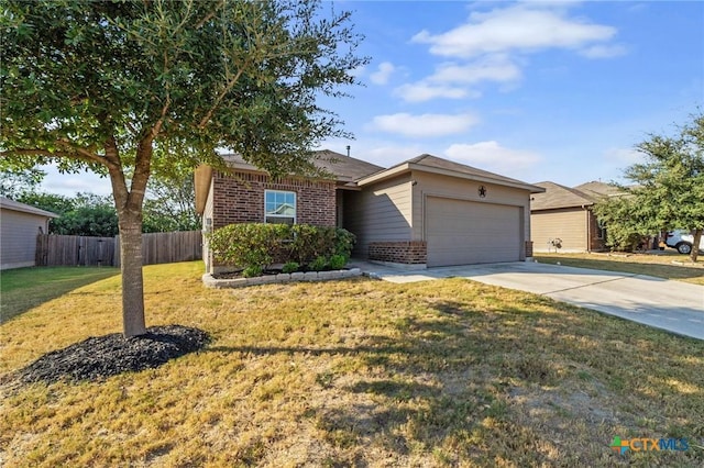 view of front of house with brick siding, fence, concrete driveway, a front yard, and a garage