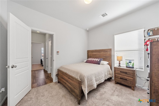 bedroom featuring carpet and visible vents