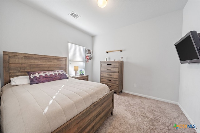 bedroom featuring visible vents, baseboards, and carpet floors