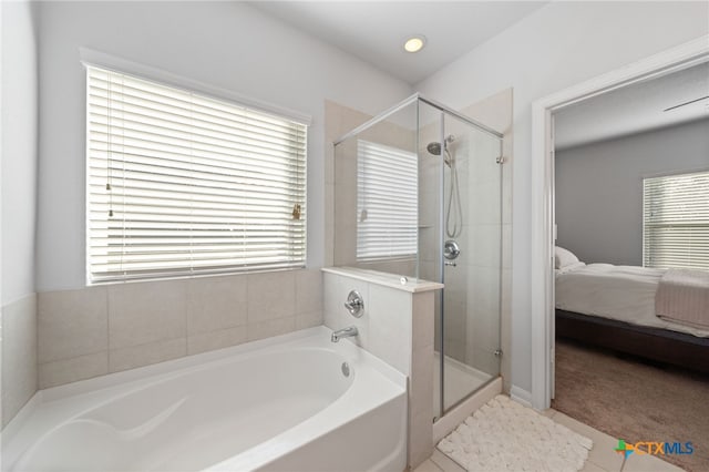 ensuite bathroom with a stall shower, a garden tub, and ensuite bath