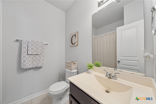 full bathroom featuring vanity, visible vents, baseboards, tile patterned flooring, and toilet